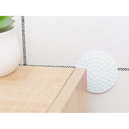 Door handle bumper self-adhesive to walls