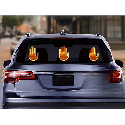 Gesture signalling hand on the rear window of a car middle finger led remote control