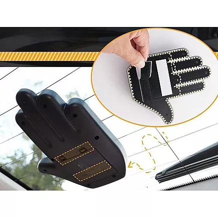 Gesture signalling hand on the rear window of a car middle finger led remote control