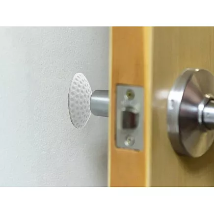 Door handle bumper self-adhesive to walls