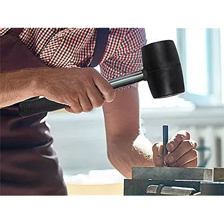 Recoilless rubber paving hammer